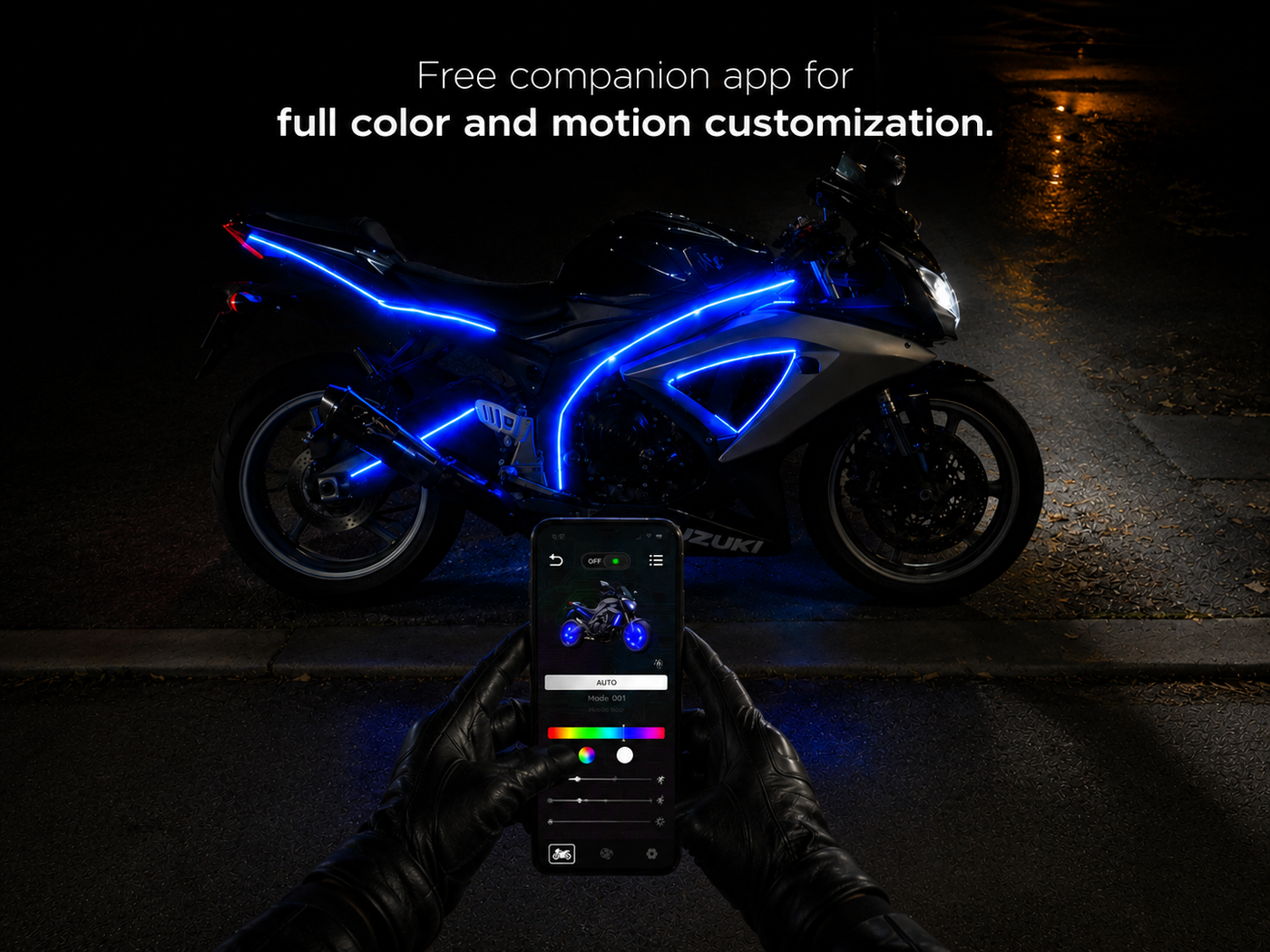 Rider holds a phone showing the Moto Auto app's color controls beside a blue-lit sport bike on a night street.